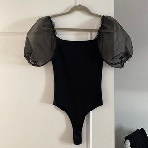 Puffy sleeve, jersey-textured bodysuit.